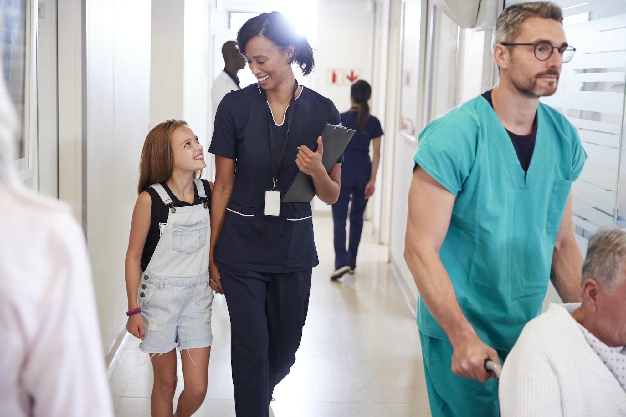 Busy Hospital Corridor With Medical Staff And Patients